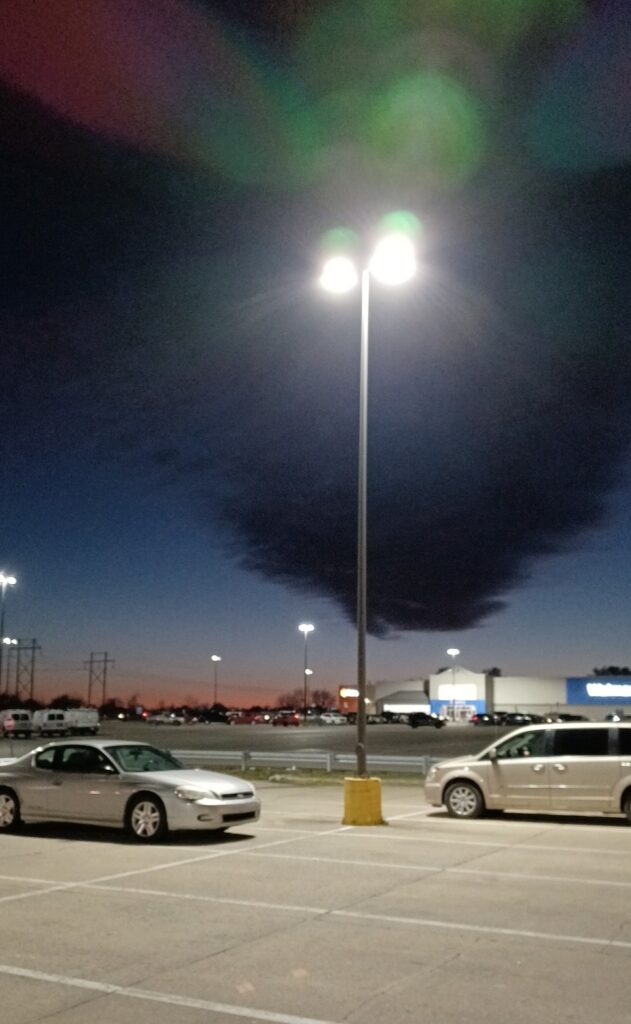 Lamp post in the middle of a parking lot